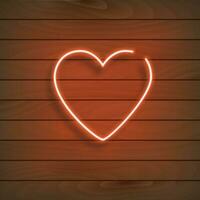 Neon heart. A bright red sign on a wooden wall. Element of design for a happy Valentine's day. Vector illustration.