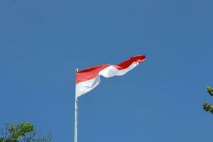 17 August 1945, Indonesian flag against sky background. Independence day concept photo