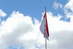 17 August 1945, Indonesian flag against sky background. Independence day concept photo