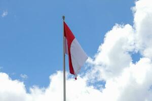 17 August 1945, Indonesian flag against sky background. Independence day concept photo