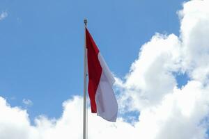 17 August 1945, Indonesian flag against sky background. Independence day concept photo