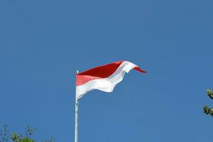 17 August 1945, Indonesian flag against sky background. Independence day concept photo