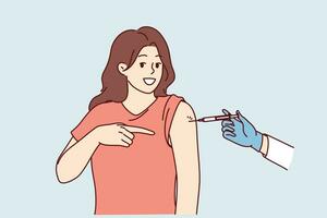 Woman gets injection in shoulder getting vaccinated and points finger at syringe in doctor hand. Preventive protection against influenza or pandemic and vaccinated to avoid infection with virus vector