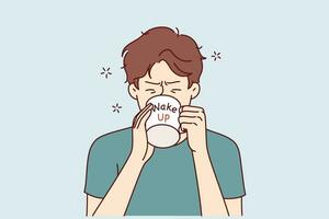 Man drinks coffee from mug with inscription wake up, wanting to cheer up and gain strength before difficult working day. Tired young guy trying to wake up with caffeine and taurine drinks vector