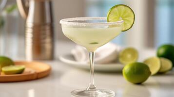 , margarita cocktail on the table in the white kitchen with lime. Alcoholic drink photo
