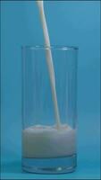 Pour the milk into the glass, Milk is a high-protein drink, drink every day for good health, Dairy products concept. video