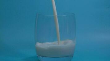 Pour the milk into the glass, Milk is a high-protein drink, drink every day for good health, Dairy products concept. video