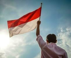 poster of man waving indonesian flag photo