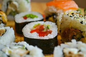 Japanese dinner with sushi rolls photo