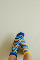 Colorful socks for Down syndrome day as background photo