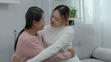 Mother day, cute asian teen girl hugging mature middle age mum. Love, kiss, care, happy smile enjoy family time. celebrate special occasion, happy birthday, merry Christmas. special day video