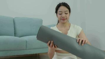 Portrait Slim asian woman her condo or home. Asian woman doing exercises in morning. balance, meditation, relaxation, calm, good health, happy, relax, healthy lifestyle, diet, slim video