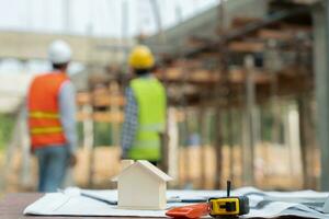 Engineers use blueprint check construction on site. Contractor and inspector inspection construction during project.civil Forman check quality assurance. Audit, inspect, quality control. photo