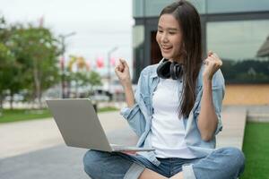 Beautiful student asian woman and friend with surprise announce final exam. Smile girl happy in college campus. Portrait female on international Asia University. Education, study, school, happy photo