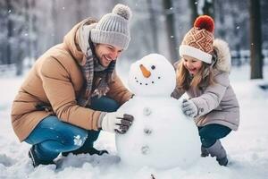 Family building a snowman in the winter park background photo