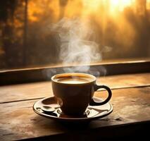 Cup of coffee on wooden table photo