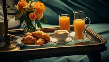 Breakfast tray with orange juice, croissants and milk in the room photo