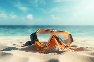 Scuba diving mask on a sandy island against blue ocean photo