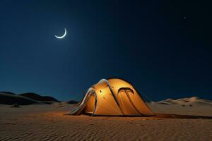 Tent with the moon shining in the night sky photo