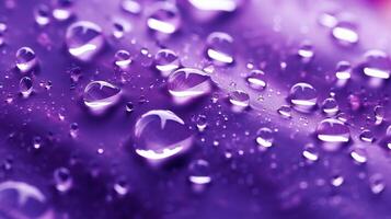 , Lavender color. Texture of light violet purple gel with drops and waves on soft background. Liquid beauty product closeup photo