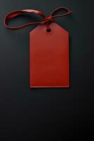 Red empty price tag on black or dark background. Black Friday concept, template copyspace photo