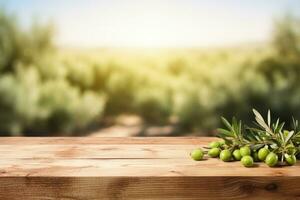 Old wooden table for product display with natural green olive field and green olives photo