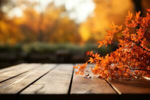 Wooden table with orange autumn leaves. Autumn background photo