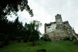 The Bran Castle in Romania. Dracula medieval castle in Carpathians, Transylvania. photo