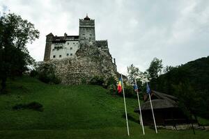 The Bran Castle in Romania. Dracula medieval castle in Carpathians, Transylvania. photo