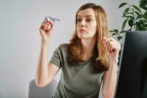 Woman procrastinate at home office workplace photo