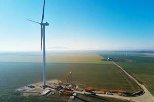 Construction site near windmill turbine, Wind generator installing photo