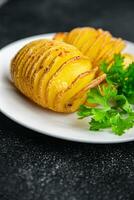 baked potato slice accordion vegetable meal food snack on the table copy space food background rustic top view photo