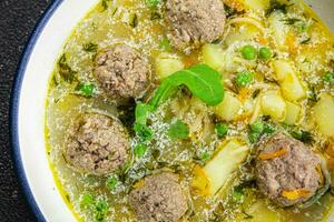 meatball soup meat balls first course vegetable food healthy meal food snack on the table copy space food background rustic top view keto or paleo diet photo