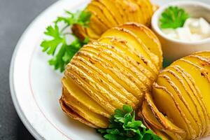 baked potato slice accordion vegetable meal food snack on the table copy space food background rustic top view photo