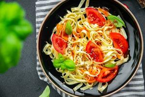 pasta tomato tagliatelle meal fresh food snack on the table copy space food background rustic top view photo