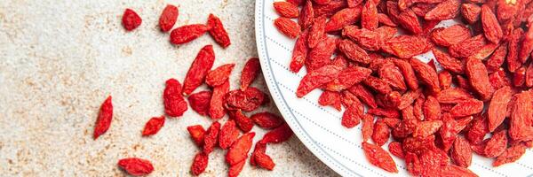 Goji berries delicious food supplement vegetable food healthy meal food snack on the table copy space food background rustic top view photo