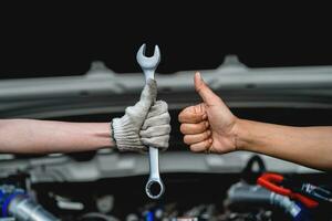 Tools of two mechanics doing service and maintenance of cars at auto workshop repair service concept Car repair and maintenance. car mechanic photo