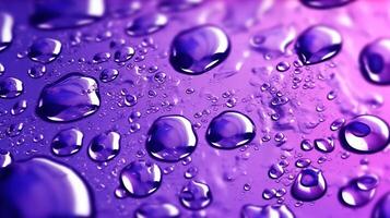 , Lavender color. Texture of light violet purple gel with drops and waves on soft background. Liquid beauty product closeup photo
