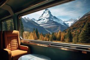 Empty train seats with snowy mountains landscape in window. photo