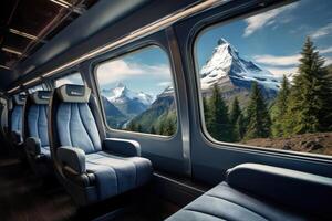 Empty train seats with snowy mountains landscape in window. photo