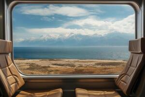 Empty train seats with snowy mountains landscape in window. photo