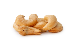 Roasted brown cashew nuts in stack isolated with clipping path. and shadow in png file format