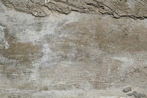 Cracked and abstract grunge texture. Aged material surface backdrop. Weathered effect pattern. Old and dirty background. photo