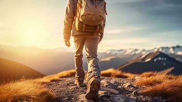 Hiking man with backpack hiking in the mountains. Hiking concept photo