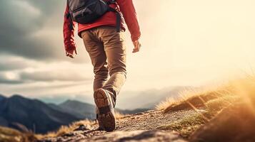 Hiking man with backpack hiking in the mountains. Hiking concept photo