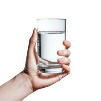 Glass of water in female hand isolated on white background with clipping path photo