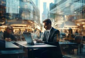 double exposure photo of a business man using laptop on his desk front view office background