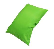 Green pillow at hotel or resort room isolated on white background with clipping path. Concept of confortable and happy sleep in daily life photo