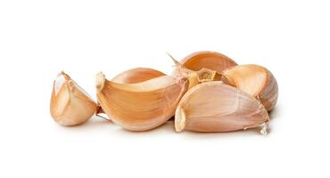 Garlic cloves in stack isolated on white background with clipping path. photo