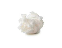 Single screwed or crumpled tissue paper or napkin in strange shape after use in toilet or restroom isolated on white background with clipping path. photo